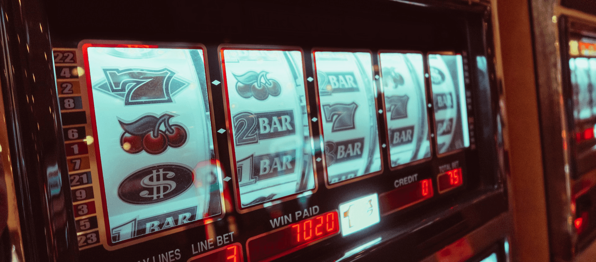 Close-up of a Las Vegas slot machine with spinning reels.
