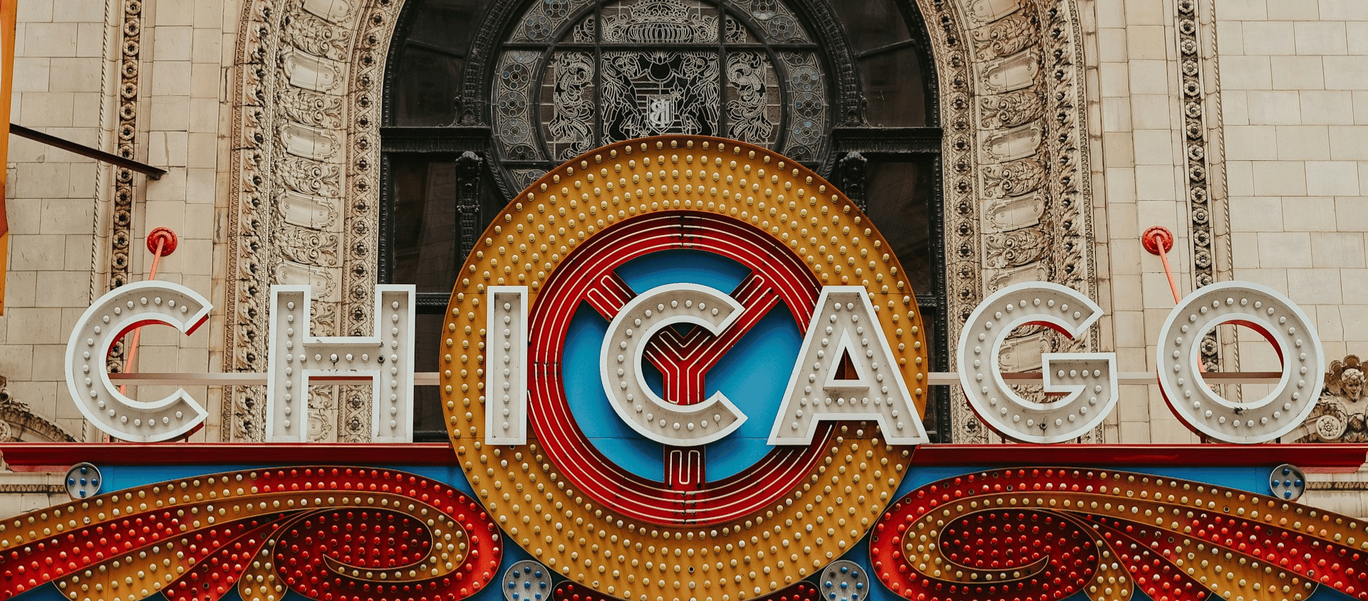 Illuminated Chicago Theatre marquee sign in the heart of downtown Chicago.