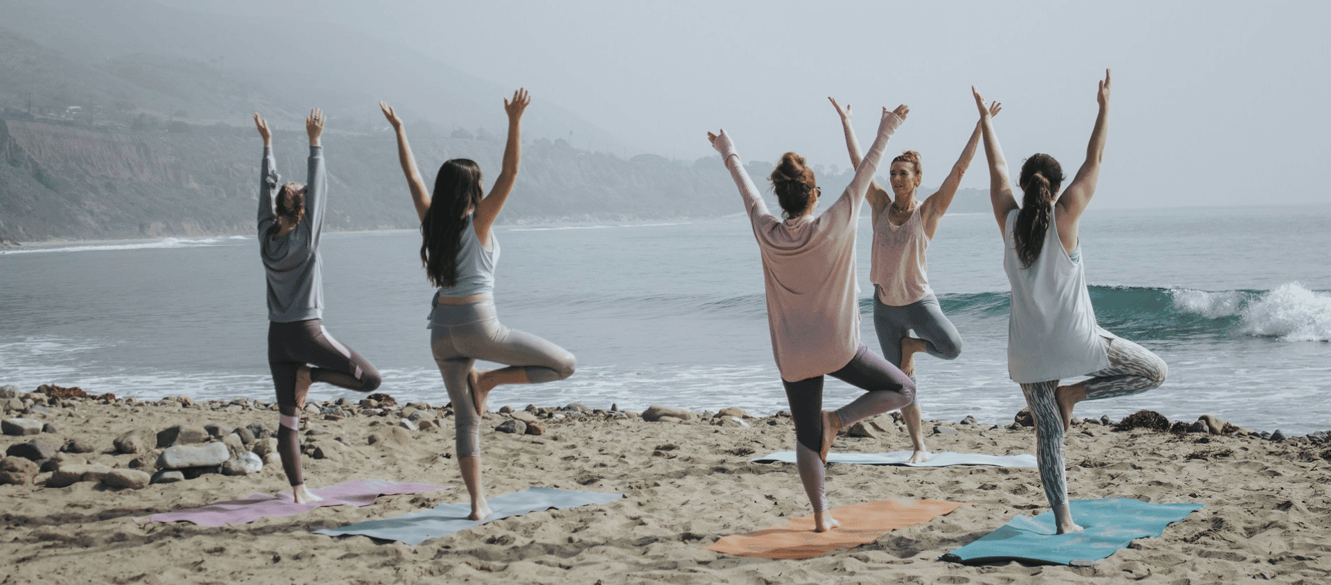 Yoga class on a beach