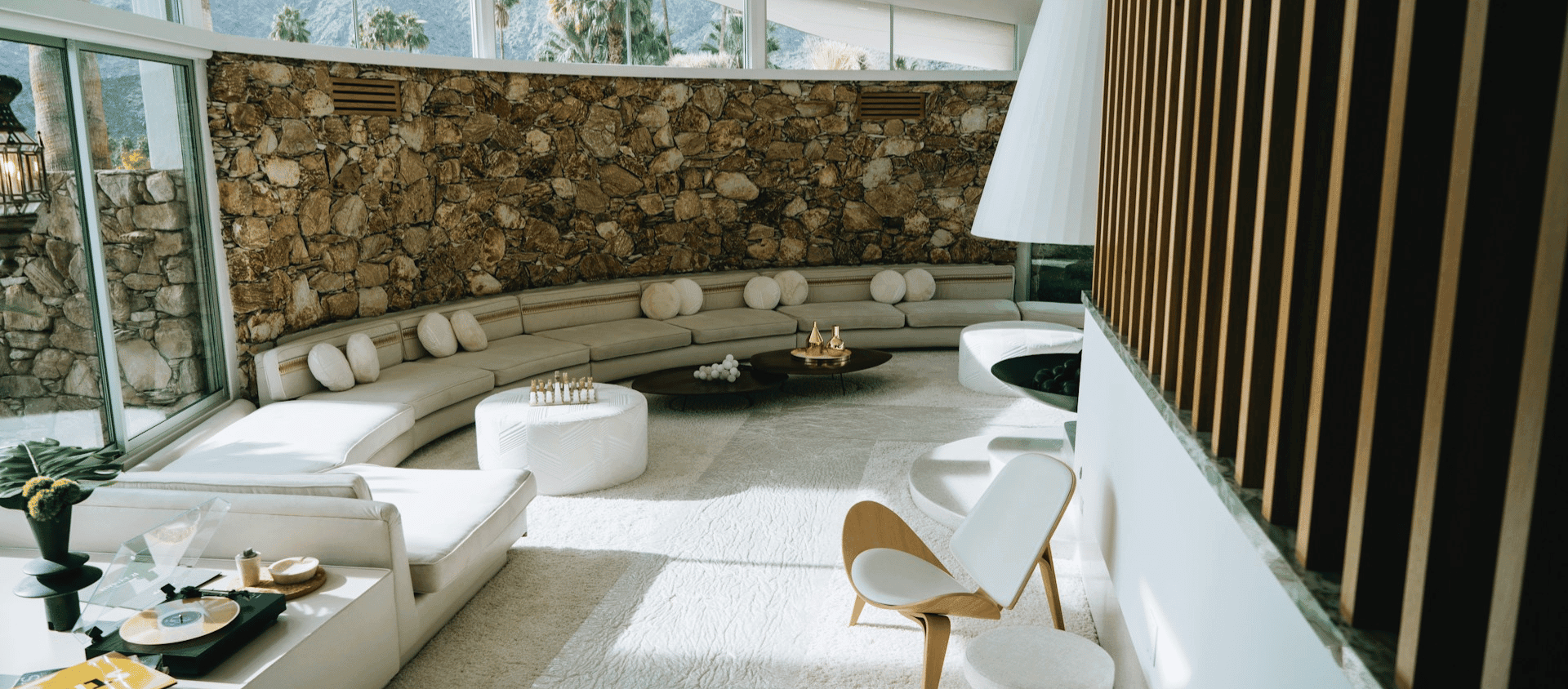 Mid-century modern poolside living room inside a Palm Springs Airbnb.