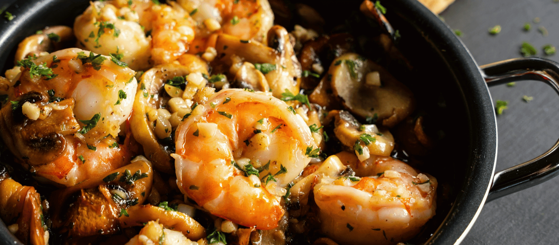 Shrimp scampi cooked in garlic butter sauce.