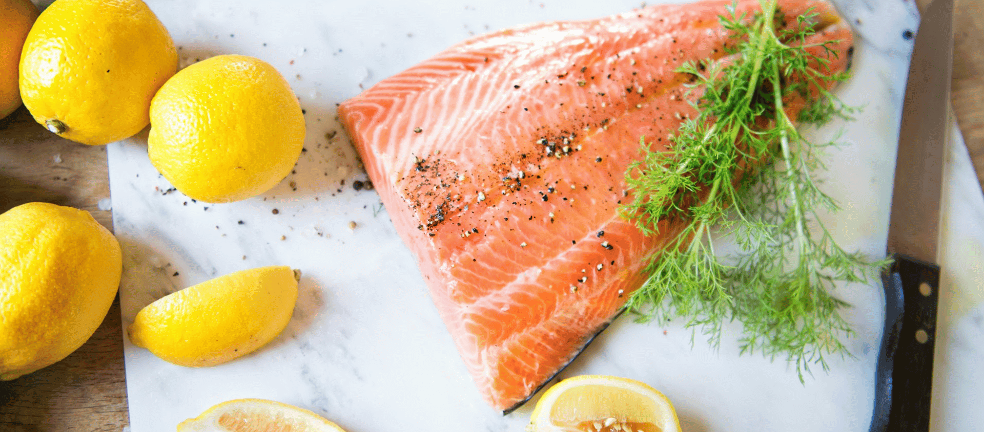 Grilled salmon fillet with lemon and fresh dill.