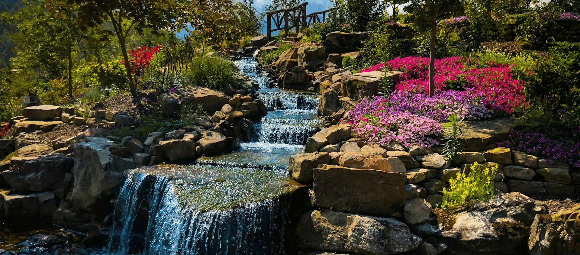 Colorful waterfall garden with blooming flowers at Anakeesta in Gatlinburg, Tennessee.