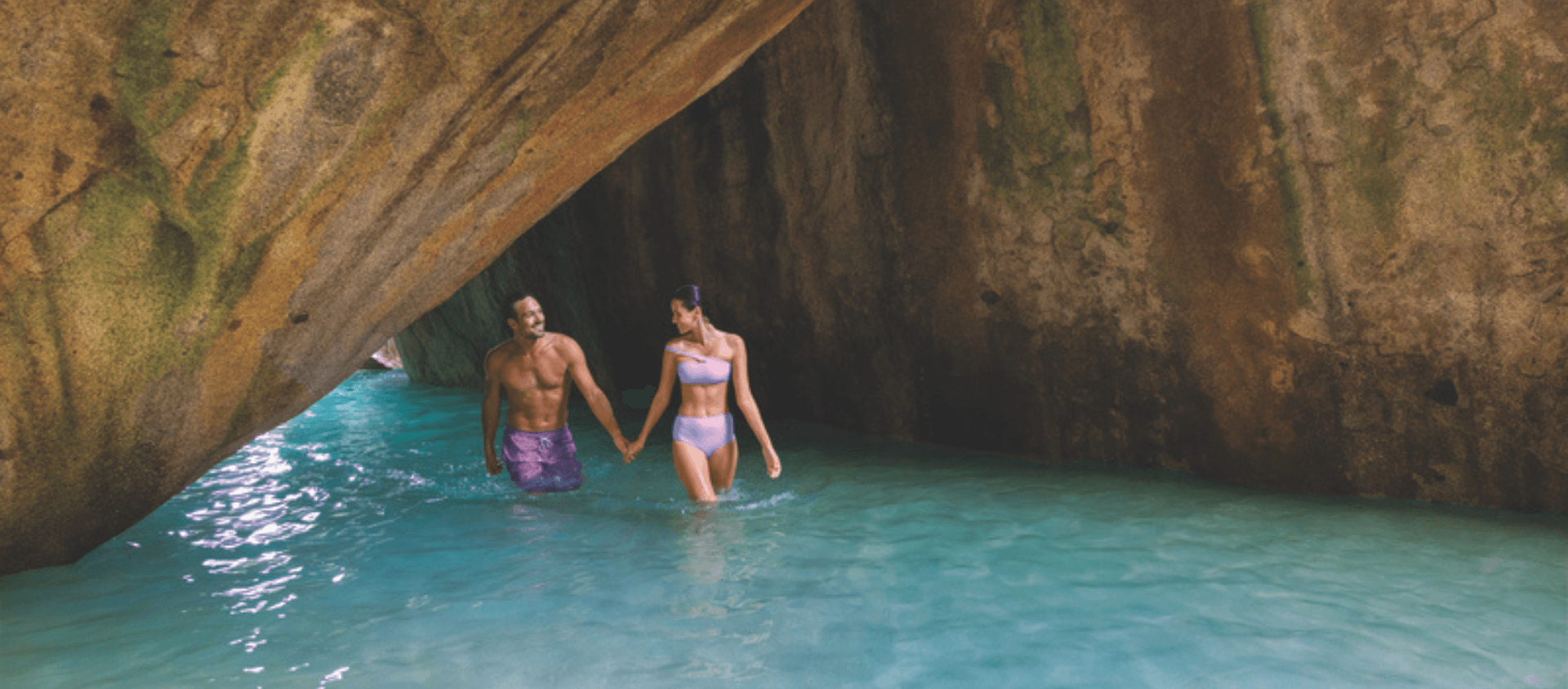 Couple exploring a cave together