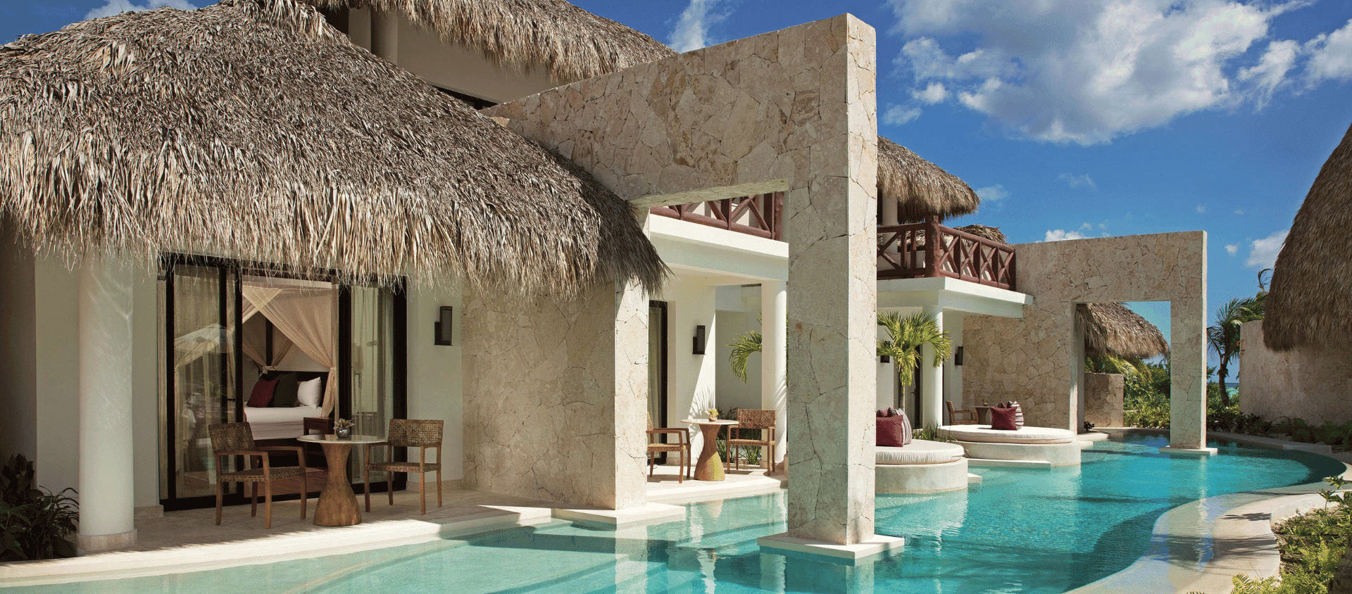 Private swim out suite with thatched roof and pool at Secrets Cap Cana.