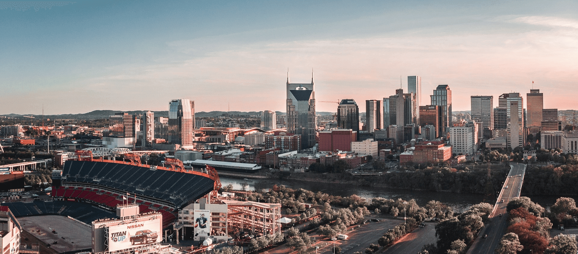 Downtown Nashville skyline at sunset overlooking Nissan Stadium