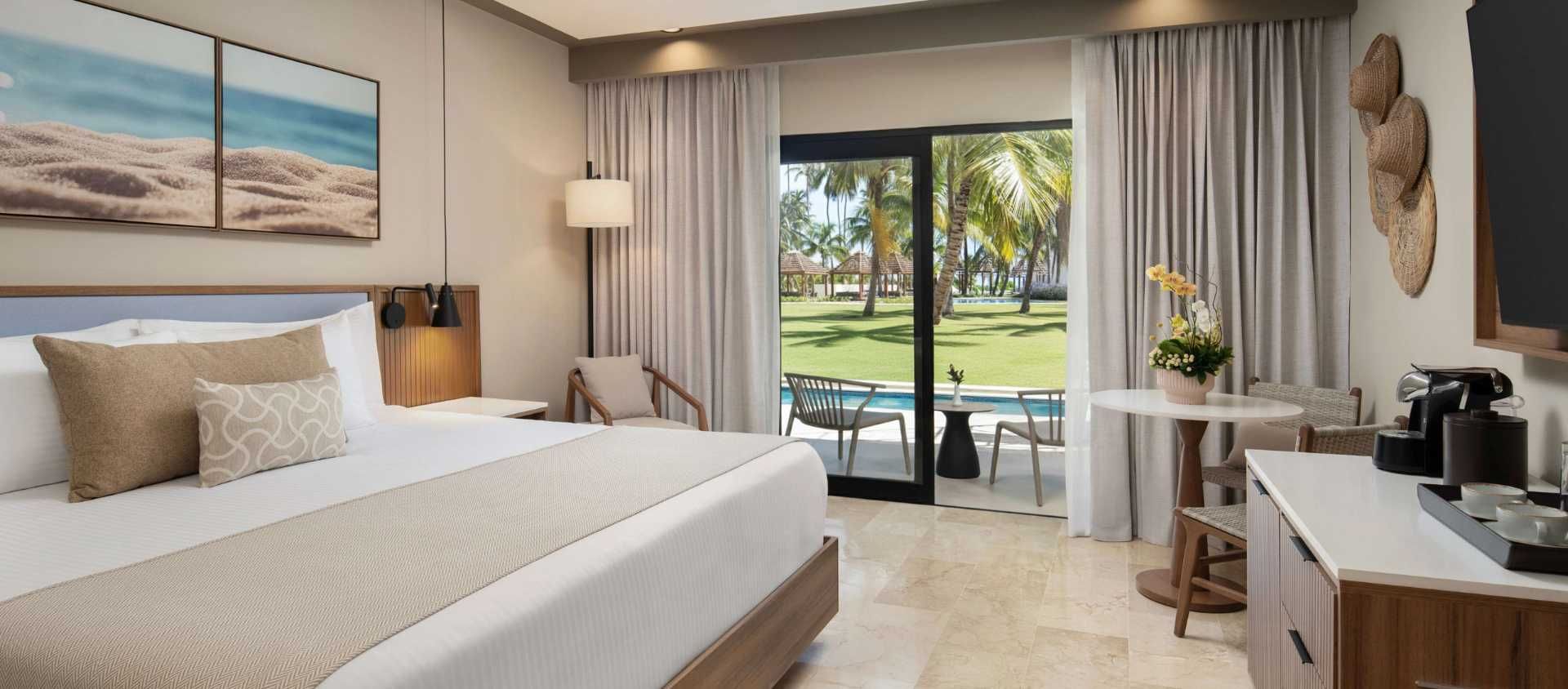 Contemporary guest room at Hyatt Vivid Punta Cana with a garden-view terrace.