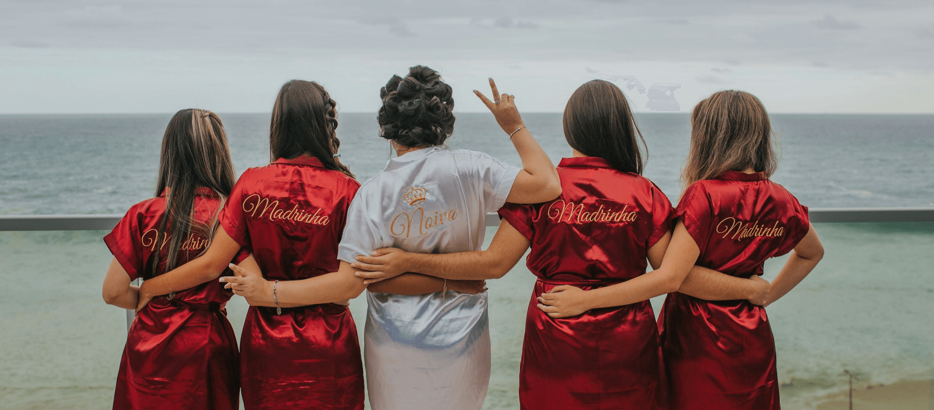Group of people overlooking the ocean at a bachelorette party