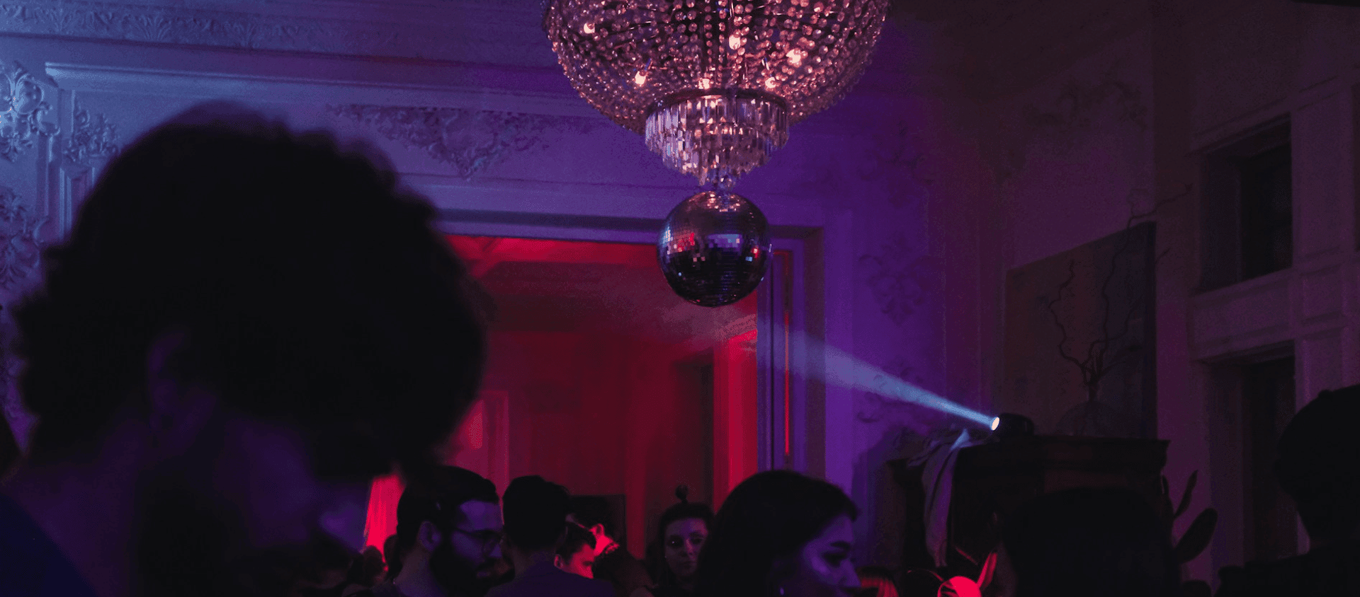 A dance party happening in a dark room.