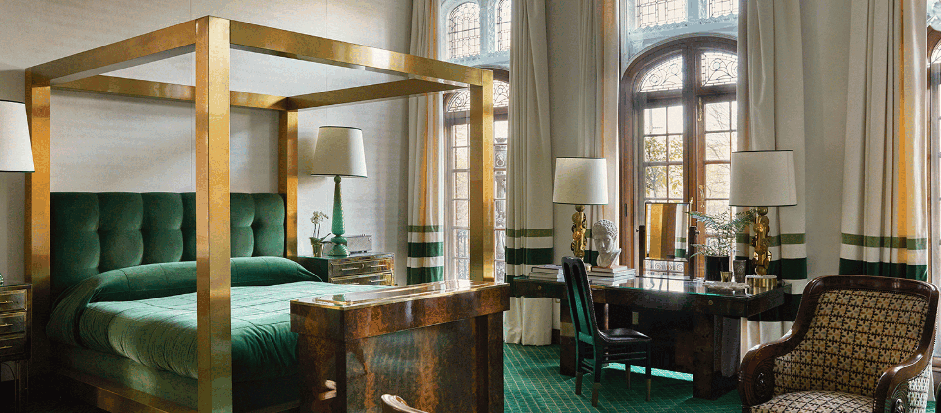 The Milestone Hotel guest suite with green velvet bed.