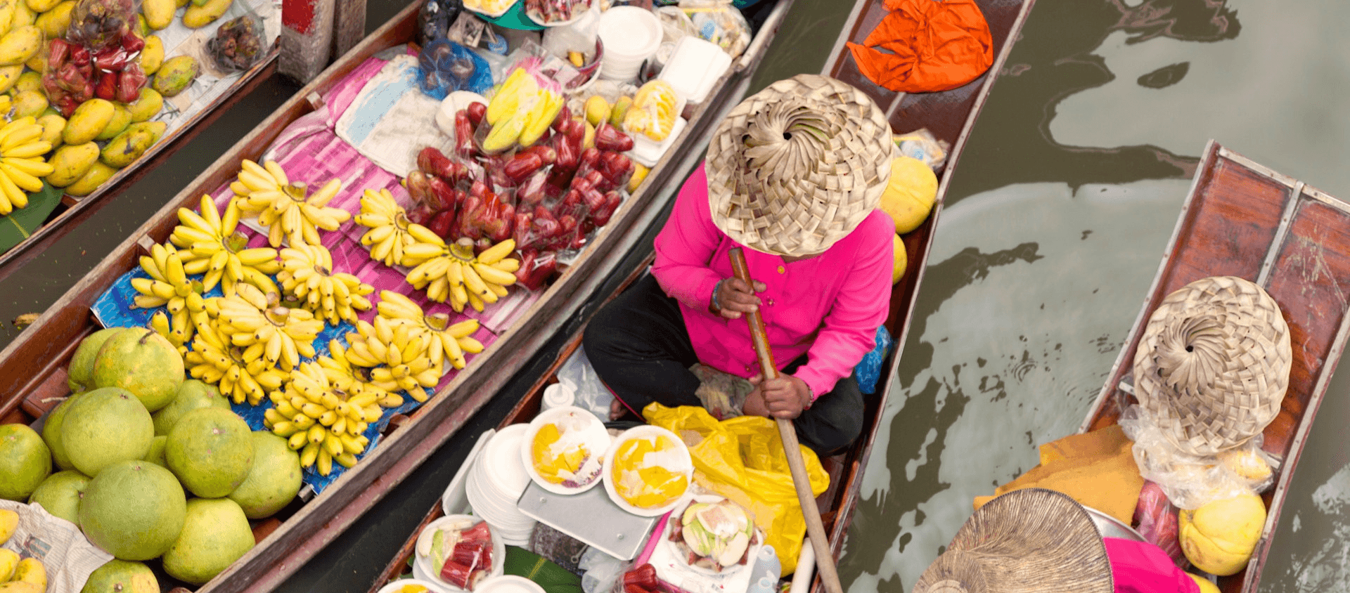 Canoes with food on a river