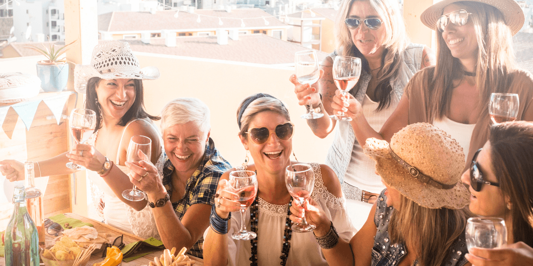 Group of people with wine glasses celebrating