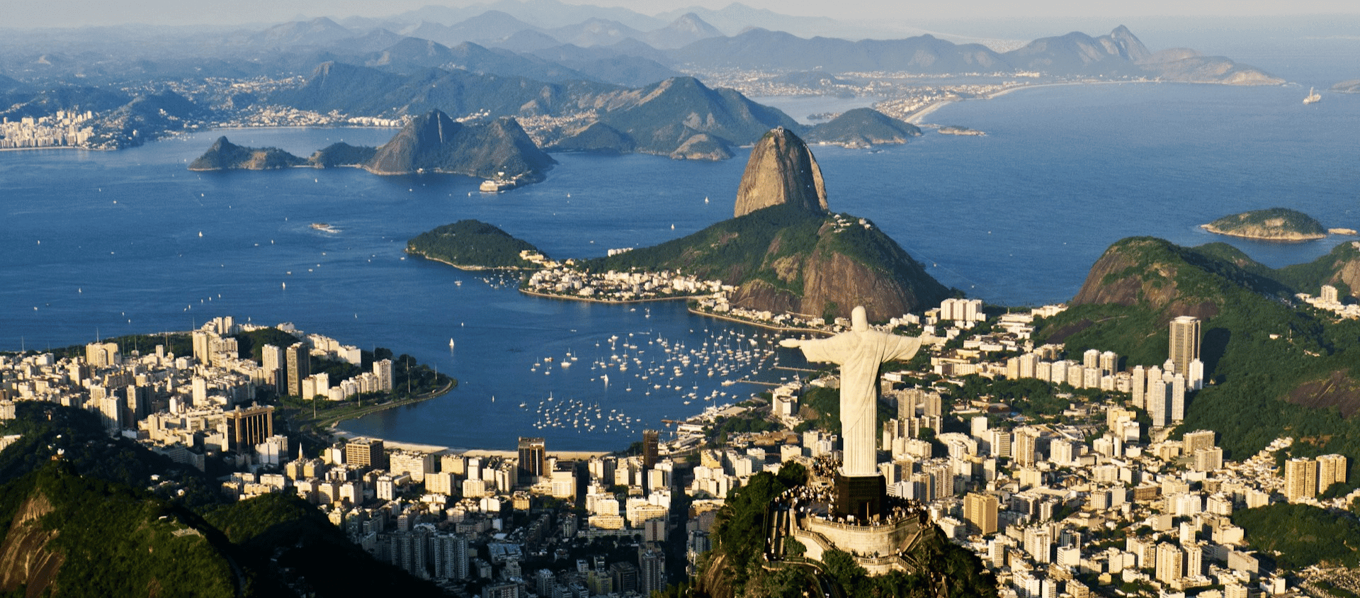 Aerial view of Rio de Janeiro with Christ the Redeemer, Sugarloaf Mountain, and Guanabara Bay.