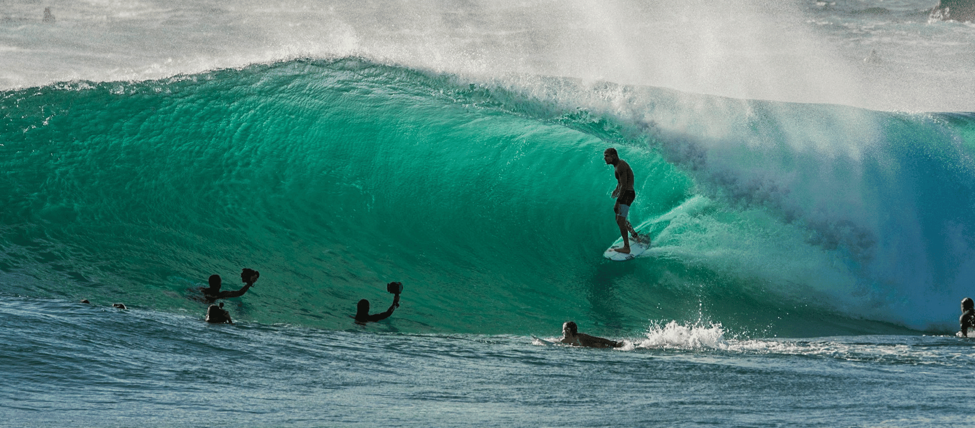 Surfer riding inside a large wave in Australia.