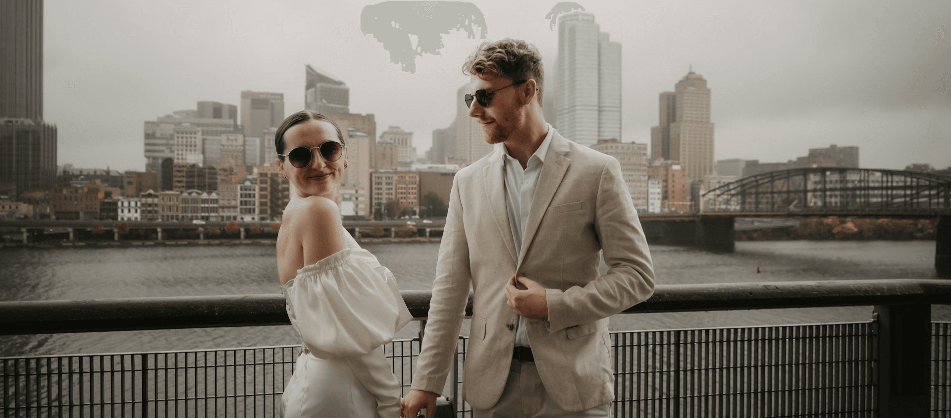 A bride and groom overlooking the city