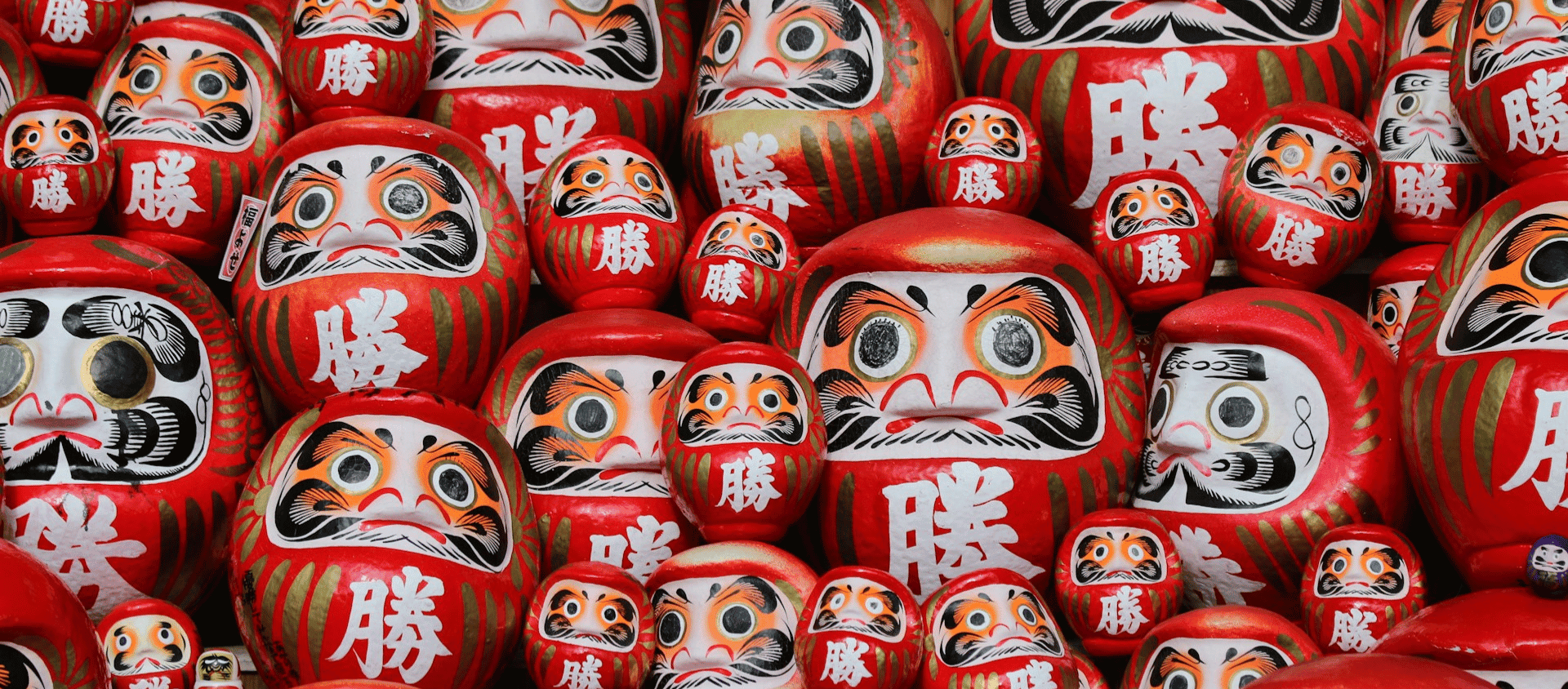 Traditional wooden street in Kyoto with pagoda at sunset.