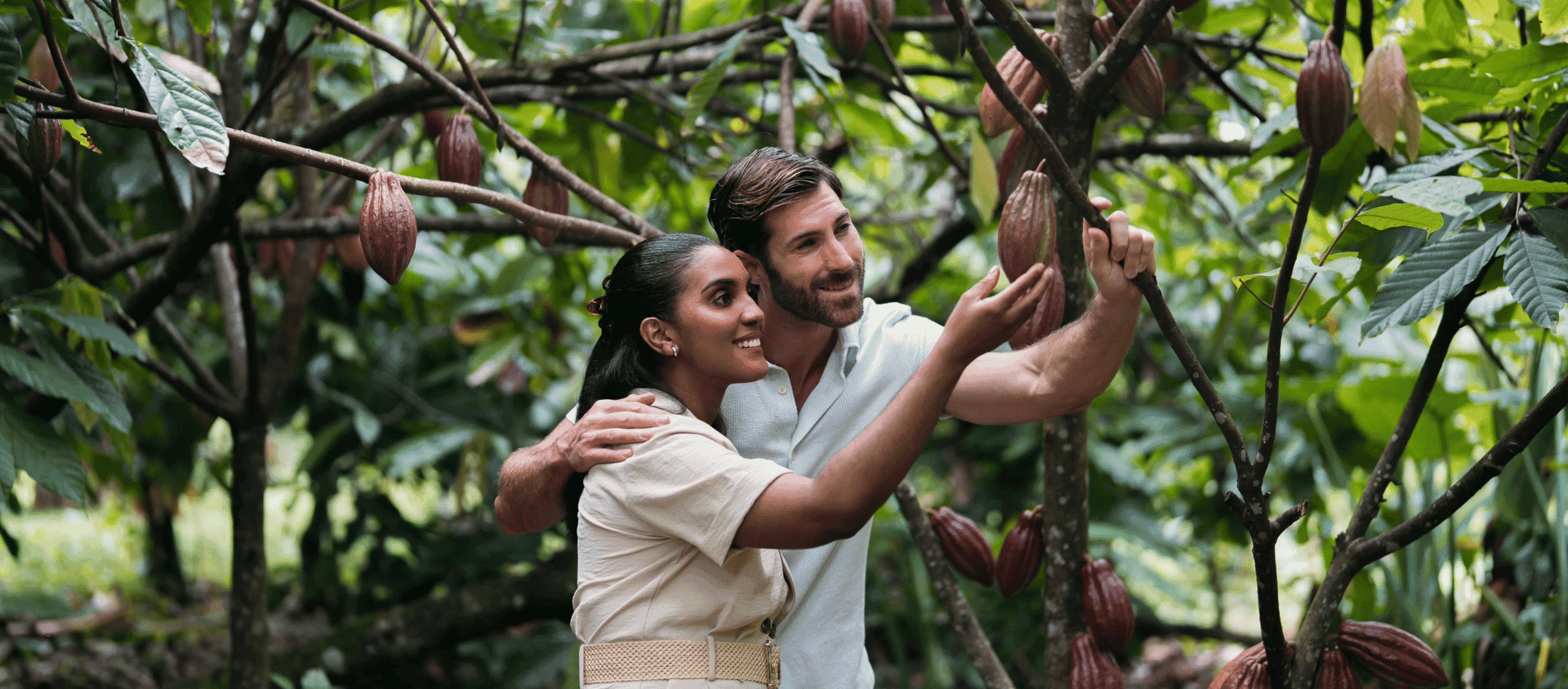 Couple exploring a cacao plantation on an eco-tour near Miches, Dominican Republic.