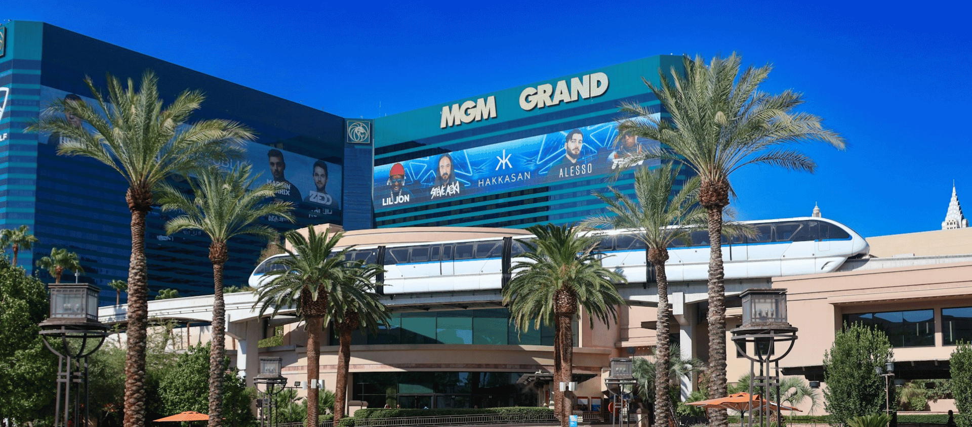 MGM Grand hotel and casino exterior on the Las Vegas Strip with the monorail passing by.