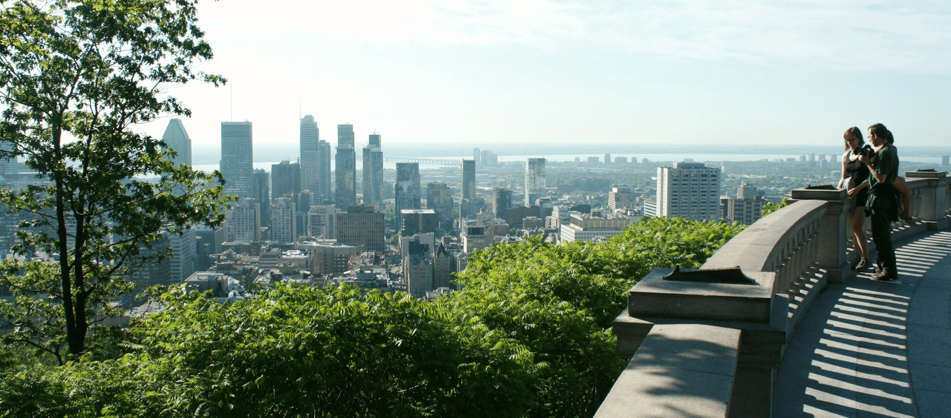 Montreal skyline viewed from Mont Royal park, a top international 21st birthday weekend getaway.