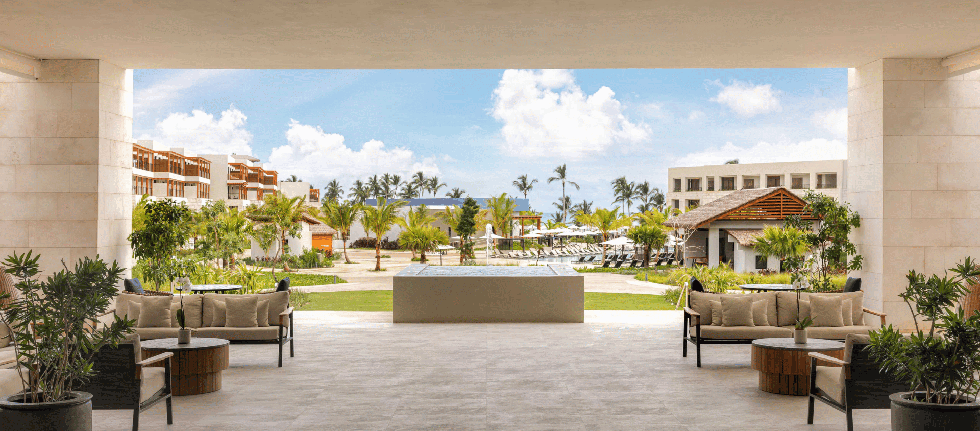 Open-air lounge overlooking the pools and beach at Secrets Playa Esmeralda.