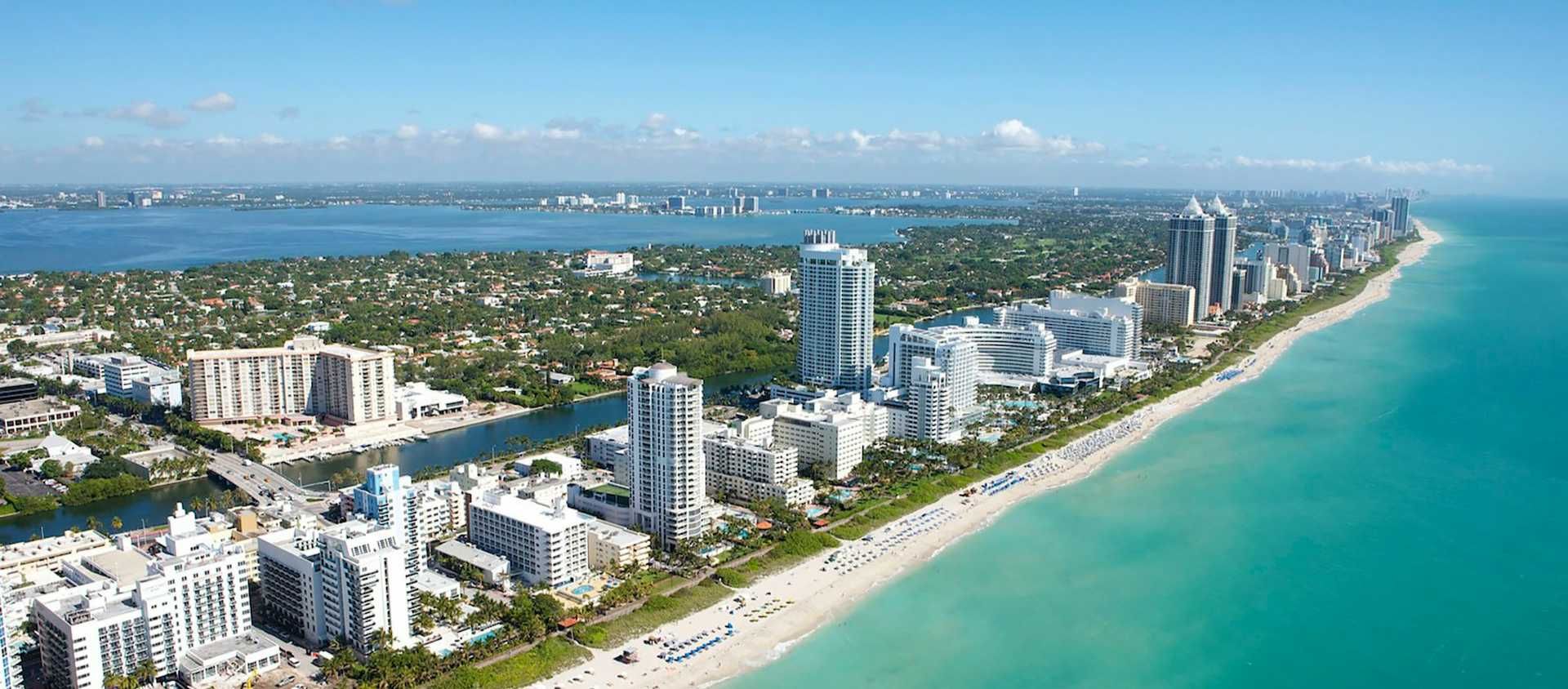 Aerial view of the South Beach coastline and high-rise hotels in Miami, Florida.