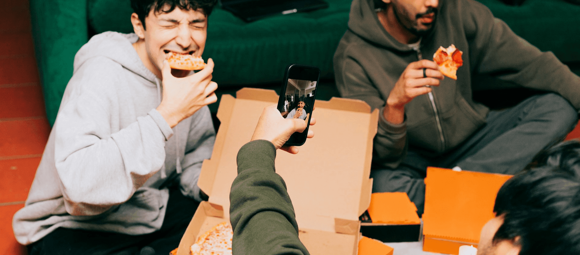 People eating pizza together