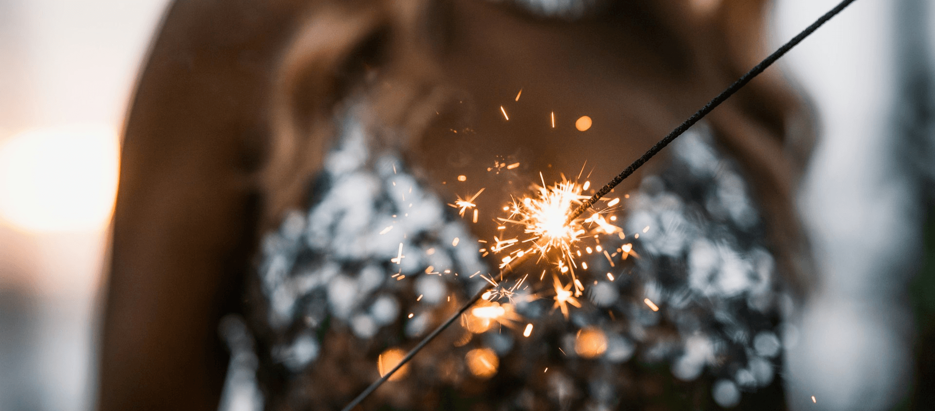 Person holding sparklers