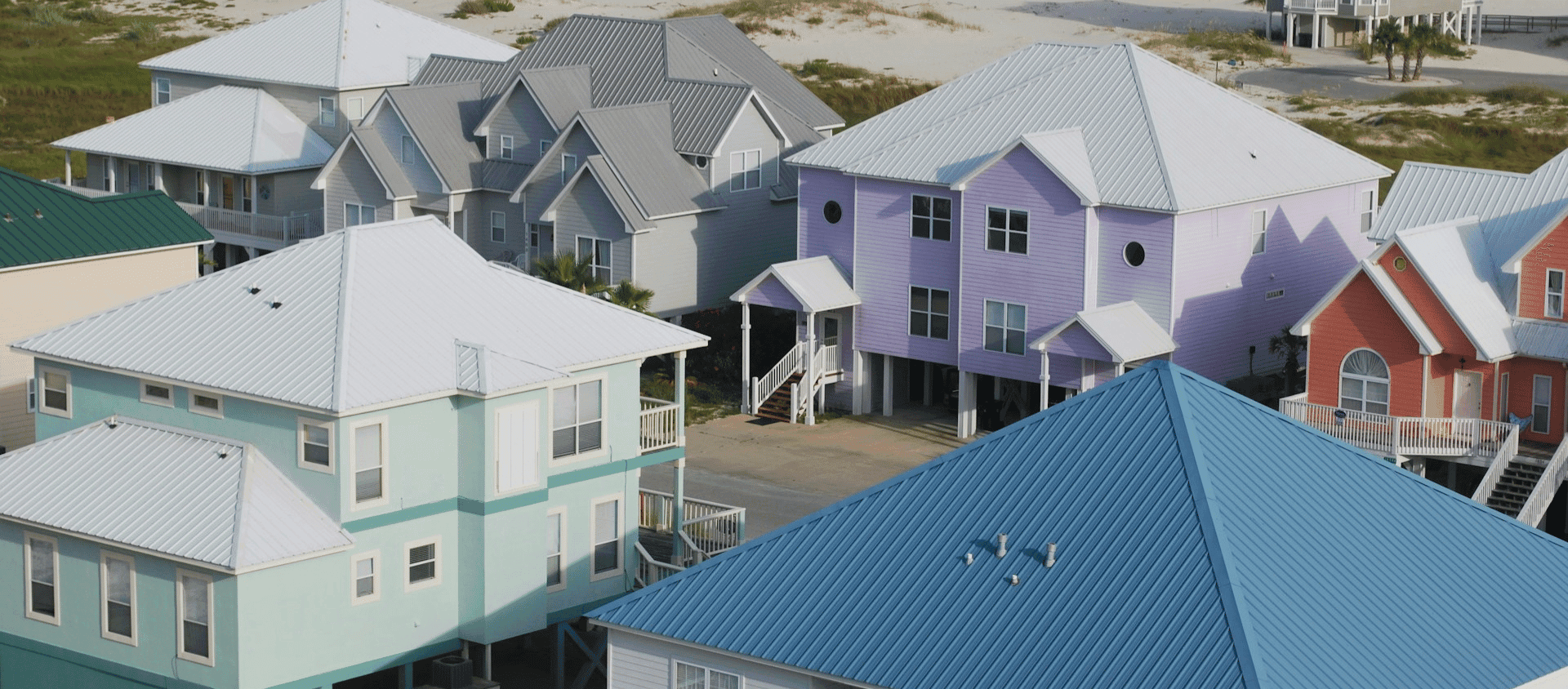 Aerial view of colorful beach houses along the Gulf Shores, Alabama coastline.