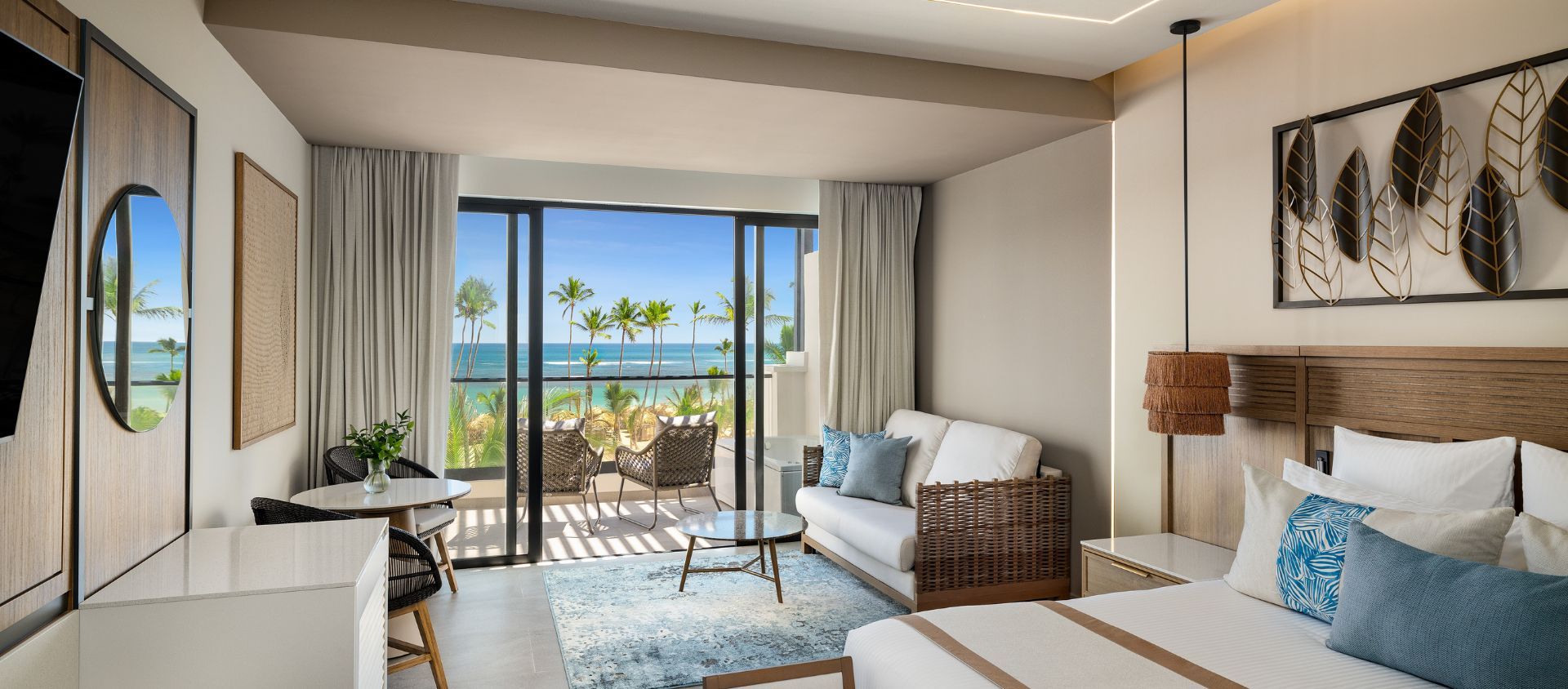 Preferred Club Suite terrace with loungers and ocean views at Secrets Tides Punta Cana.