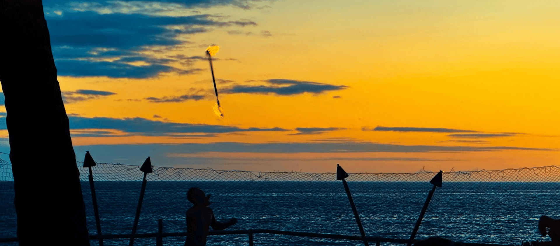 A sunset view of a hawaiian luau