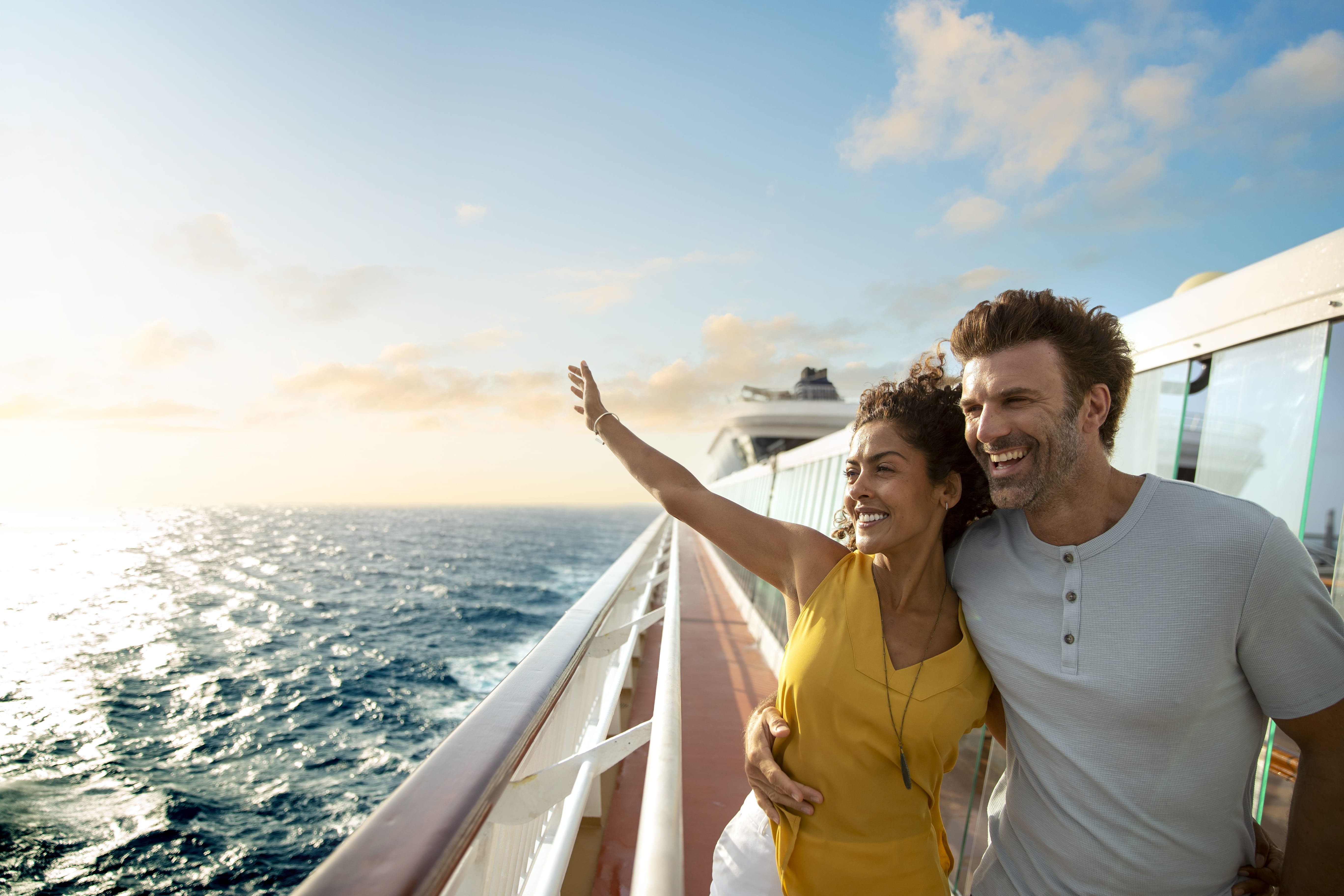 Couple embracing overlooking deck on Norwegian Cruise Line