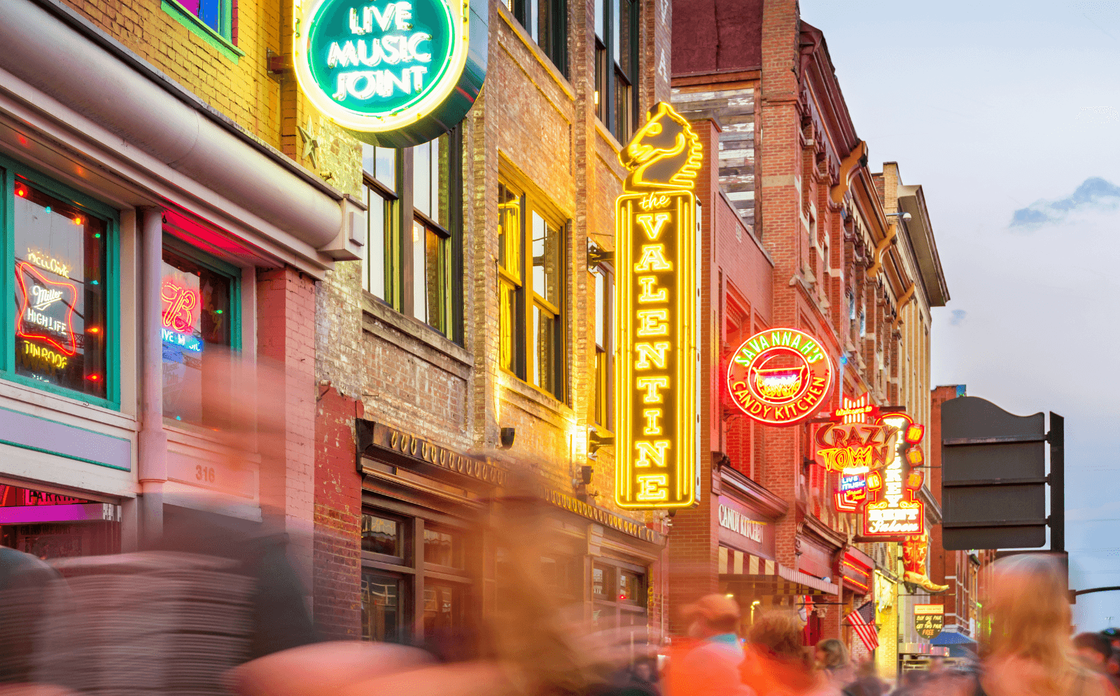 Neon honky-tonk signs on Broadway in Nashville, a lively birthday getaway in the US.