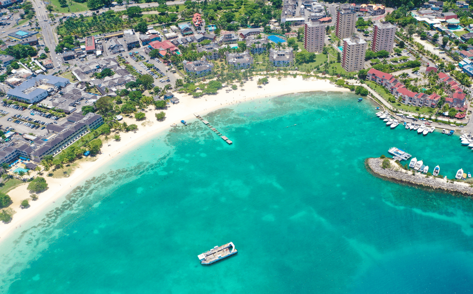 Aerial view of the coastline in Ocho Rios, a budget-friendly beach birthday destination.