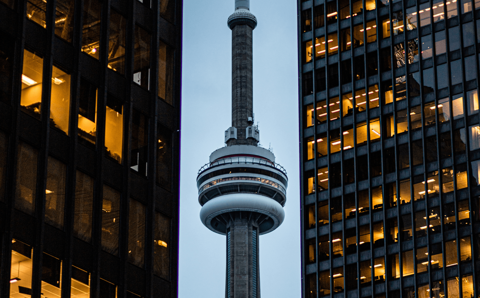 The CN Tower rising above downtown Toronto, a fun city birthday trip destination.
