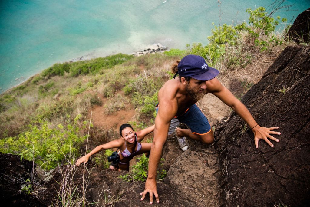 A couple going on a rigorous hike in Hawaii.