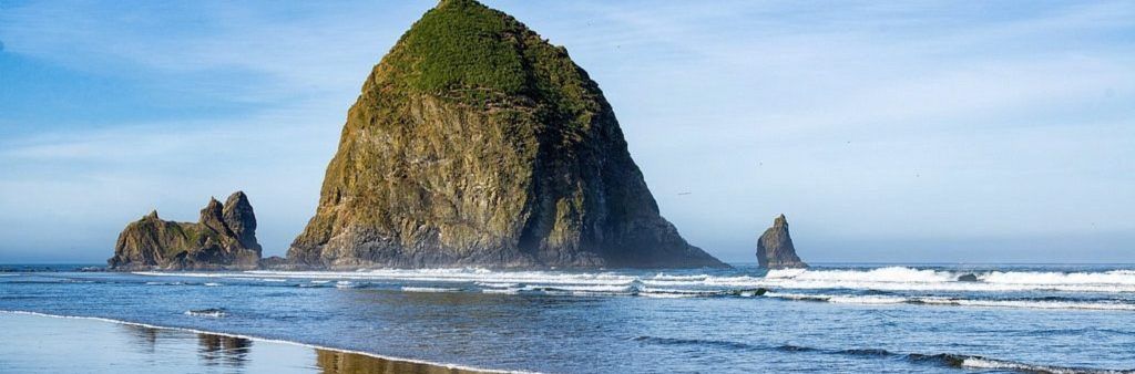 Cannon Beach, Oregon coastline with waves.