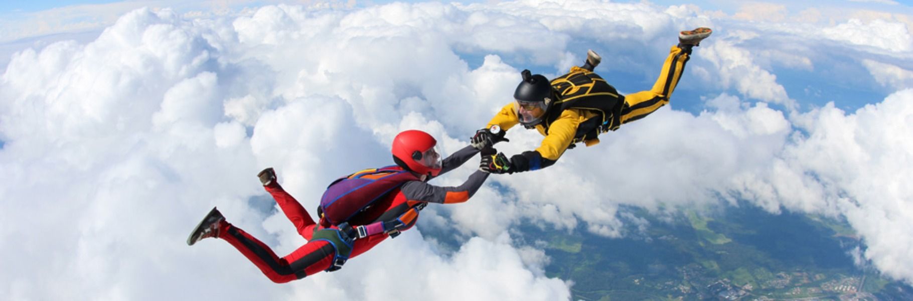Couple skydiving during their honeymoon